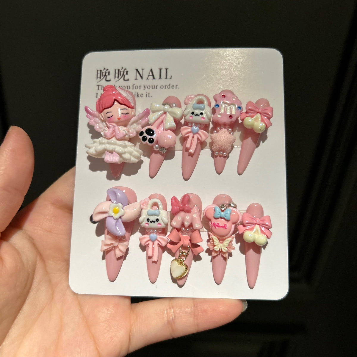 Handmade Baby Pink Long Stiletto Press On Nails with 3D Angel Doll, Cute Cartoon Charms, Bows & Heart Chain Tassels
