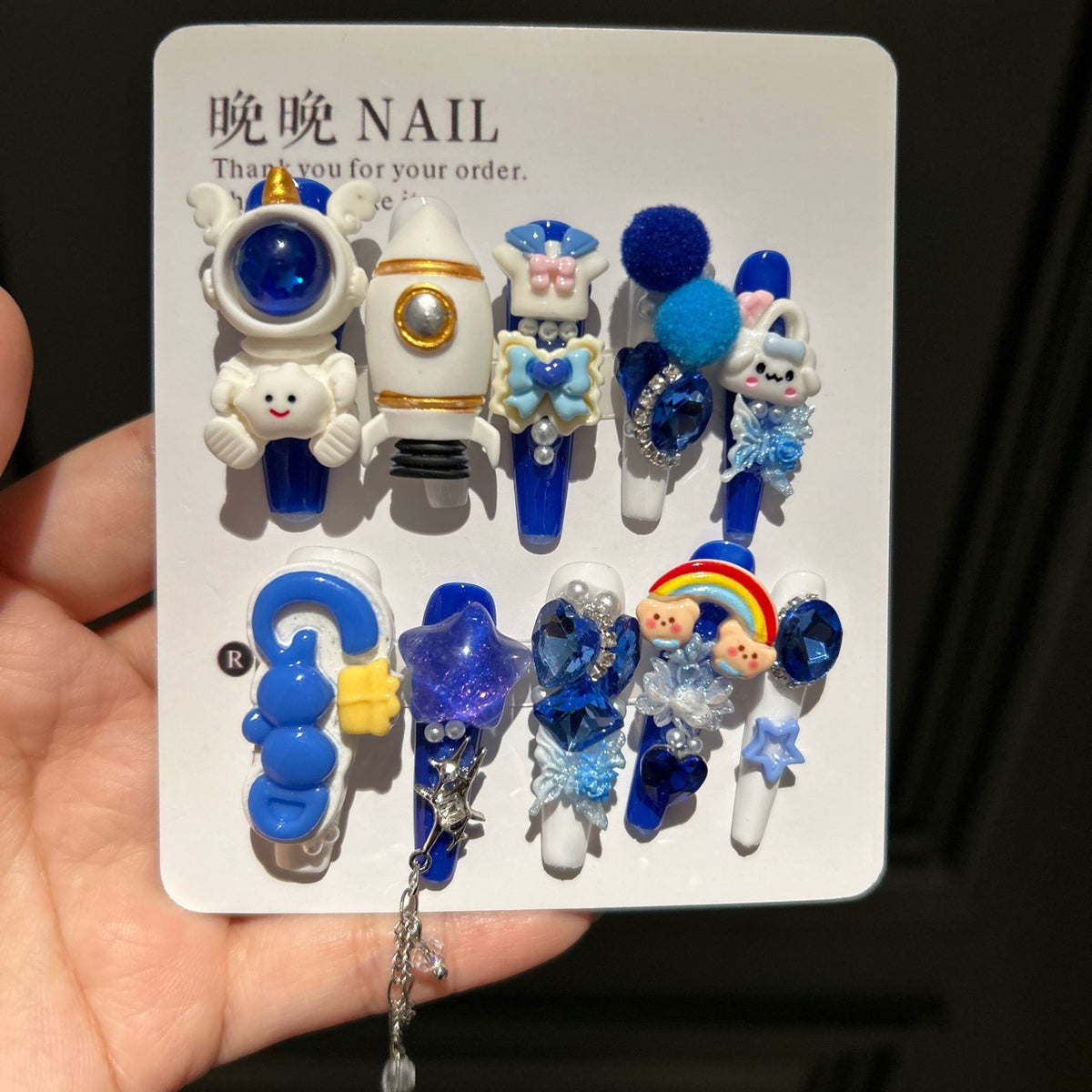 Klein Blue & White Stiletto Press-on Nails with 3D Astronaut, Rocket, Rainbow Bear, Fluffy Ball, and Interlinked Chain - Space Kawaii Fake Nail Set