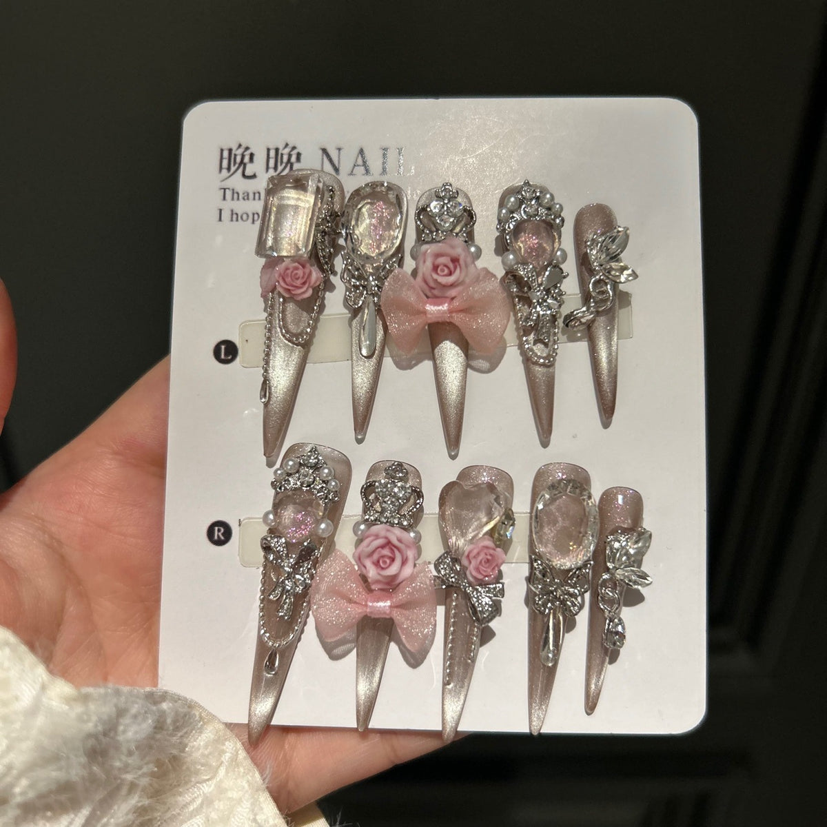 Champagne Nude Cat Eye Stiletto Press-on Nails with Oversized Crystals, 3D Pink Rose, Sheer Bow, Crown, and Crystal Draping Charm - Luxury Glam Fake Nail Set