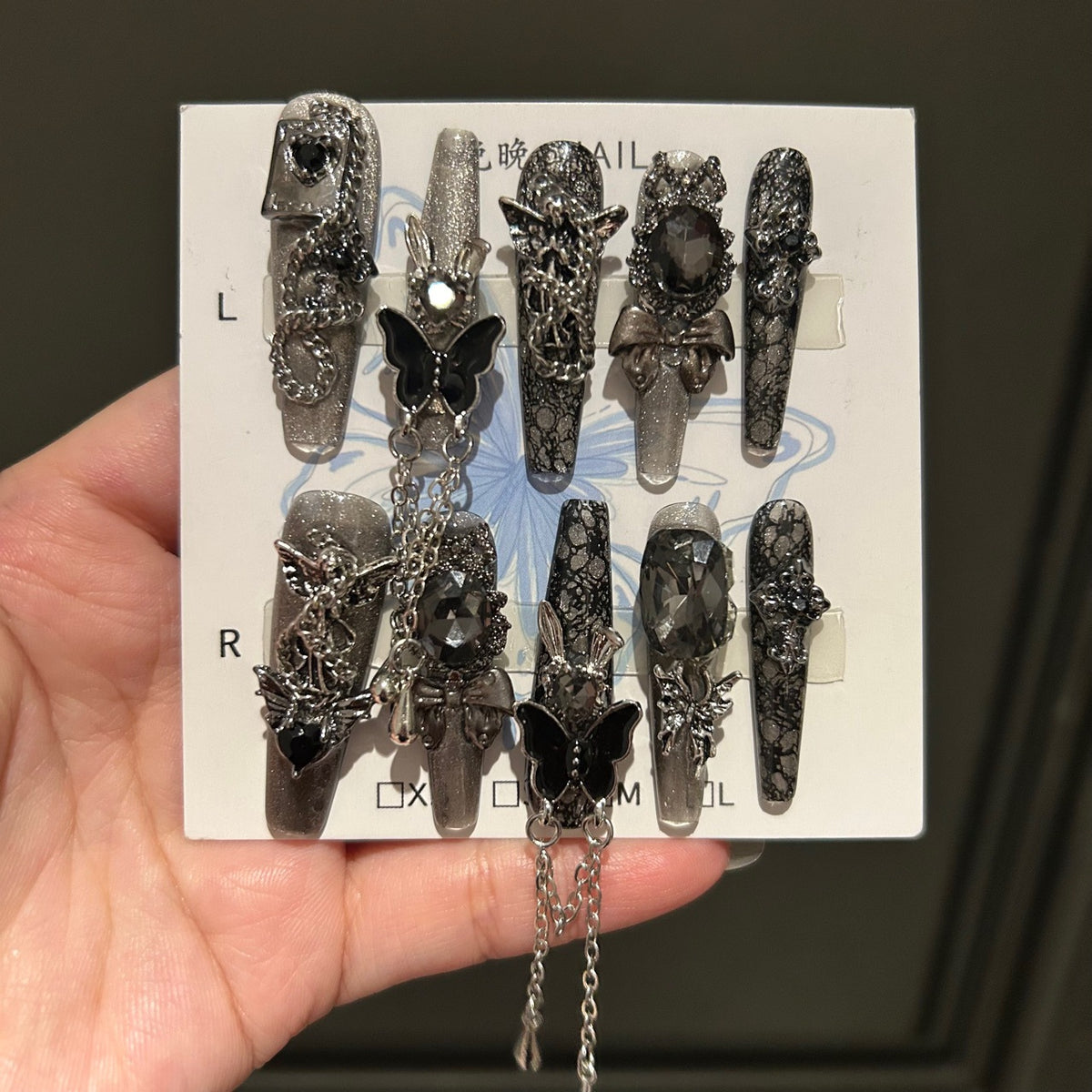 Dark Silver Cat Eye Coffin Press-on Nails with 3D Black Crystal, Lace Texture, Angel, and Hanging Chain Charms - Gothic Glam Fake Nail Set