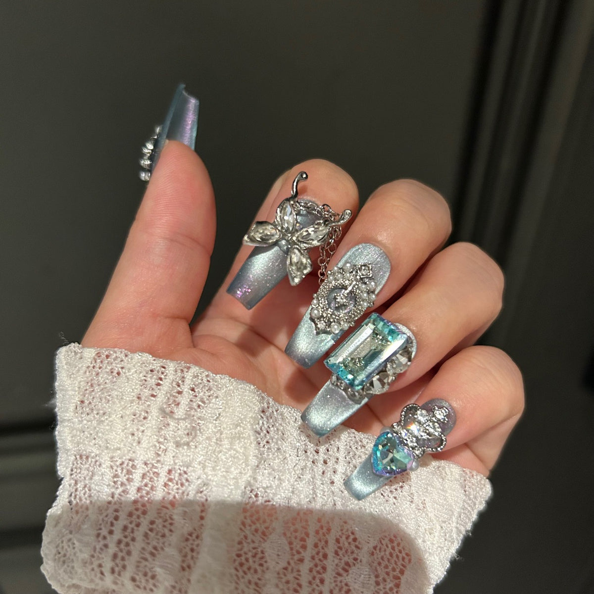 Handmade Ice Blue Cat Eye Long Coffin Press On Nails with Giant Aqua Crystals, Silver Butterfly Charms, Crown Ornaments & Hanging Chain Tassels