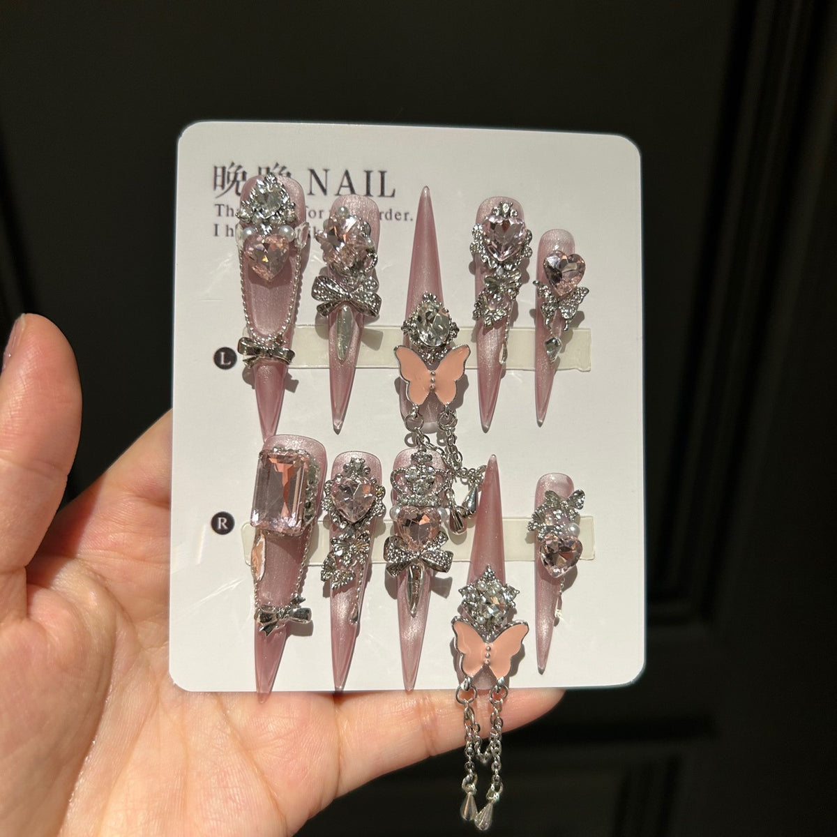 Handmade Soft Nude Pink Press On Nails, Long Stiletto Princess False Nails with Pink Heart Rhinestones, 3D Butterfly, Silver Bow Charms, Pearls & Dangling Silver Chain, Reusable Fake Nails for Wedding & Party