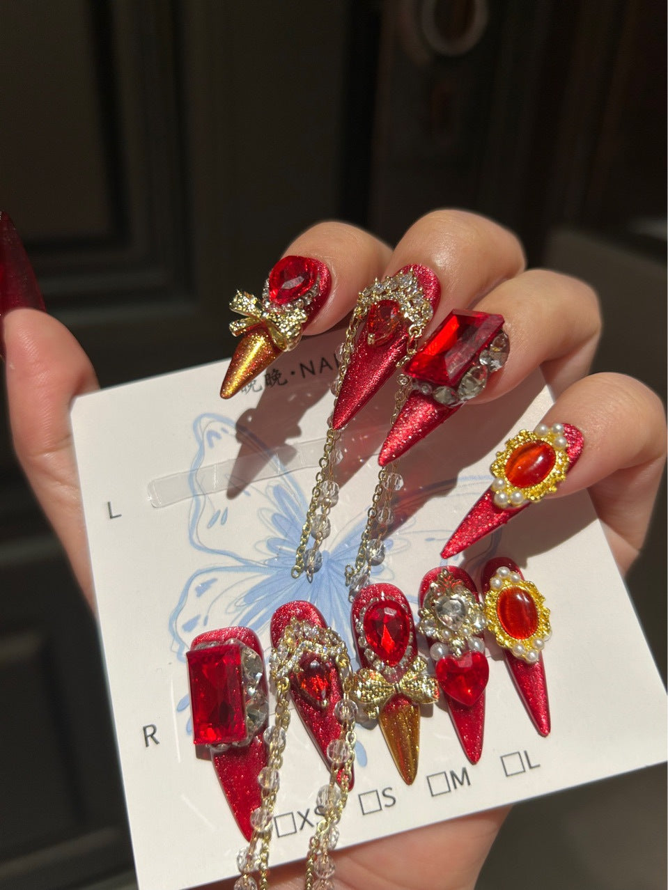 Handmade Red Glitter Press On Nails, Long Stiletto Luxury Royal False Nails with Large Ruby Rhinestones, Gold Charms, Pearls & Long Dangling Crystal Chains, Reusable Fake Nails for Party, Cosplay & Holiday