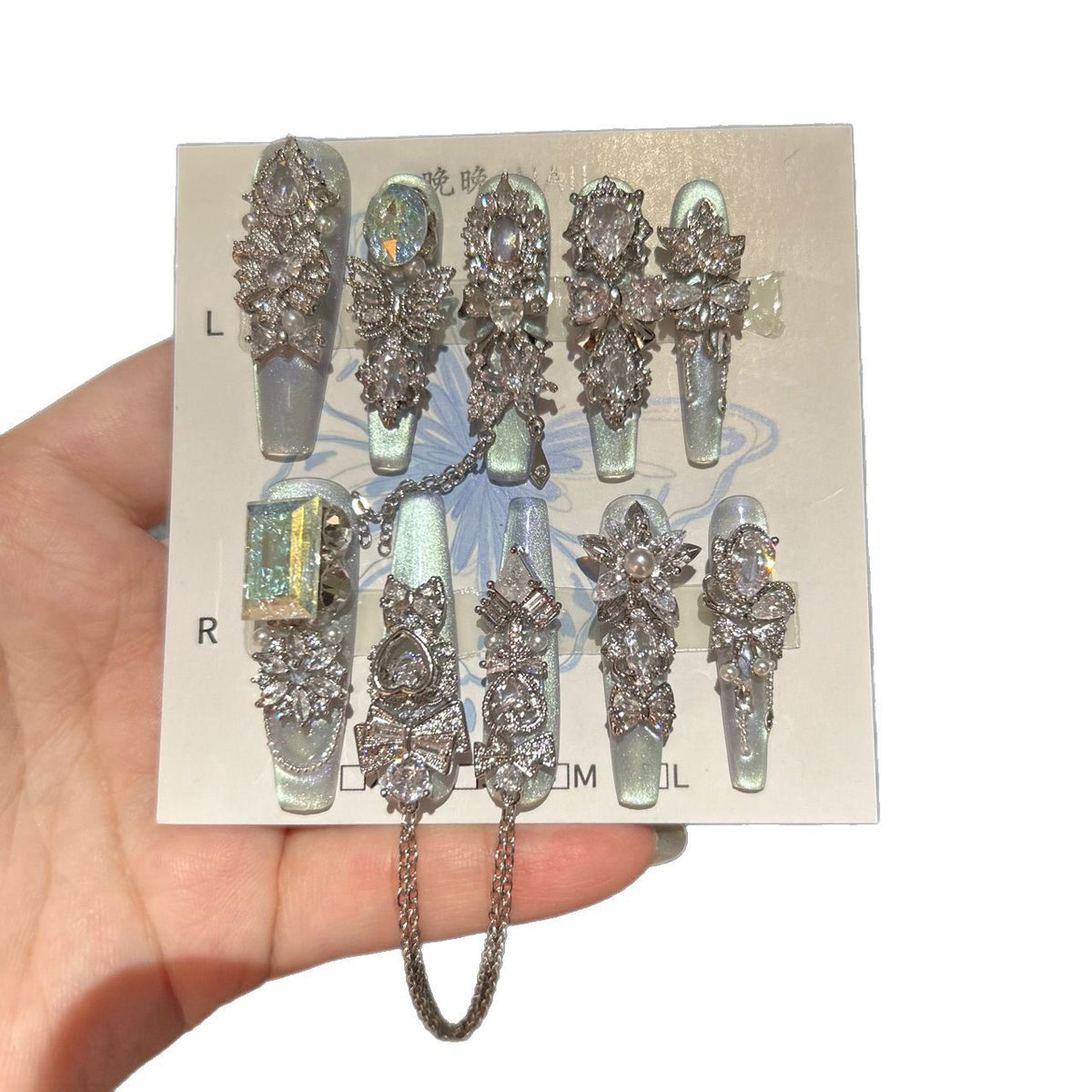 Silver Blue Cat Eye Coffin Press-on Nails with Over-sized Crystal Gems, Bowknot, and Interlinked Hanging Chain - Luxury Glam Fake Nail Set