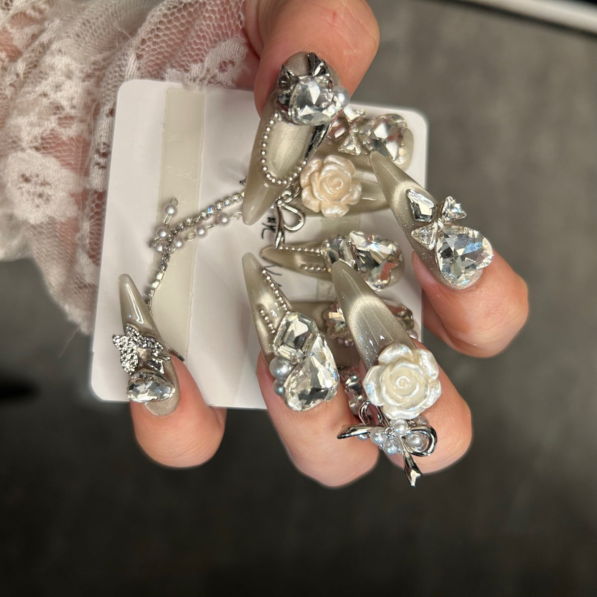 Champagne Cat Eye Stiletto Press-on Nails with Oversized Crystal Diamonds, 3D White Rose, Bow, and Pearl Rhinestone Chain - Luxury Glam Fake Nail Set