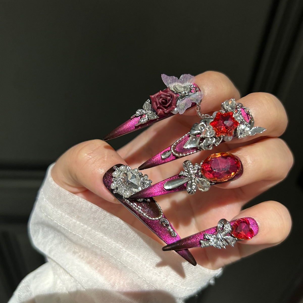 Burgundy Cat Eye Stiletto Press-on Nails with Oversized Ruby Crystals, 3D Dark Red Rose, Bow, and Interlinked Chain - Gothic Glam Fake Nail Set