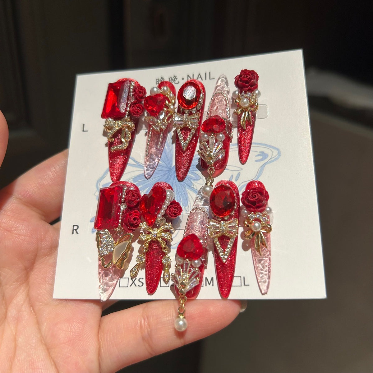 Ruby Red Cat Eye Stiletto Press-on Nails with 3D Rose, Crystal Rhinestone, and Hanging Chain Charms - Luxury Statement Fake Nail Set
