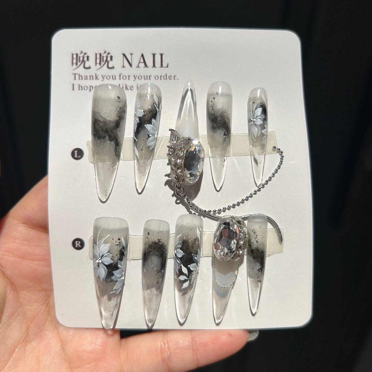 Handmade Ink Wash Black Grey Ombre Long Stiletto Press On Nails with Hand Painted White Flowers, Giant Oval Crystals & Silver Chain Tassels