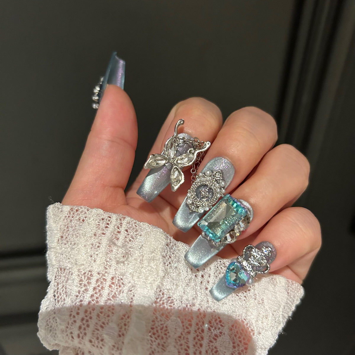 Handmade Ice Blue Cat Eye Long Coffin Press On Nails with Giant Aqua Crystals, Silver Butterfly Charms, Crown Ornaments & Hanging Chain Tassels