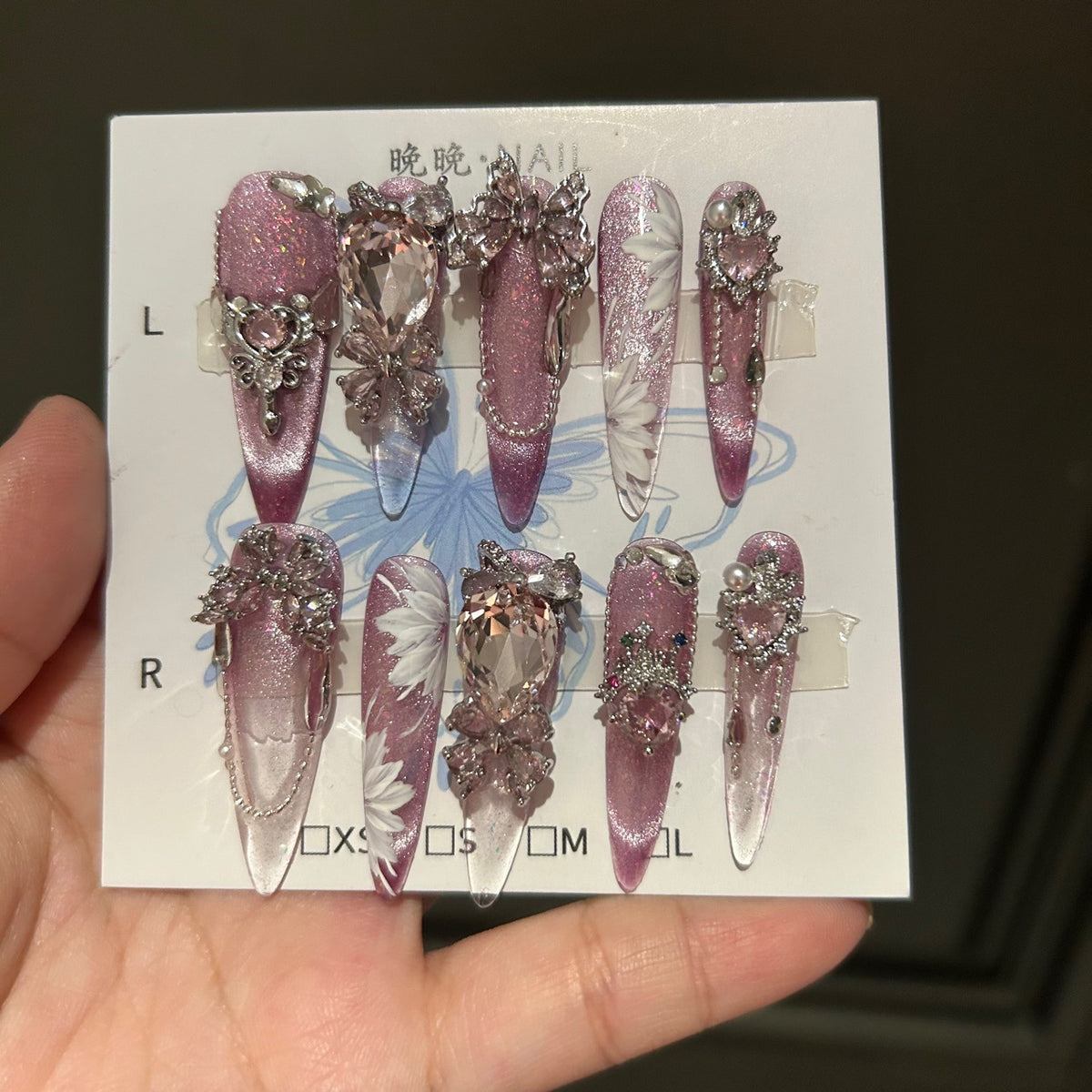 Handcrafted Designer Pink Press-on Nails - Shimmering Cat Eye Base with Intricate 3D Floral, Rhinestones and Chain Drops