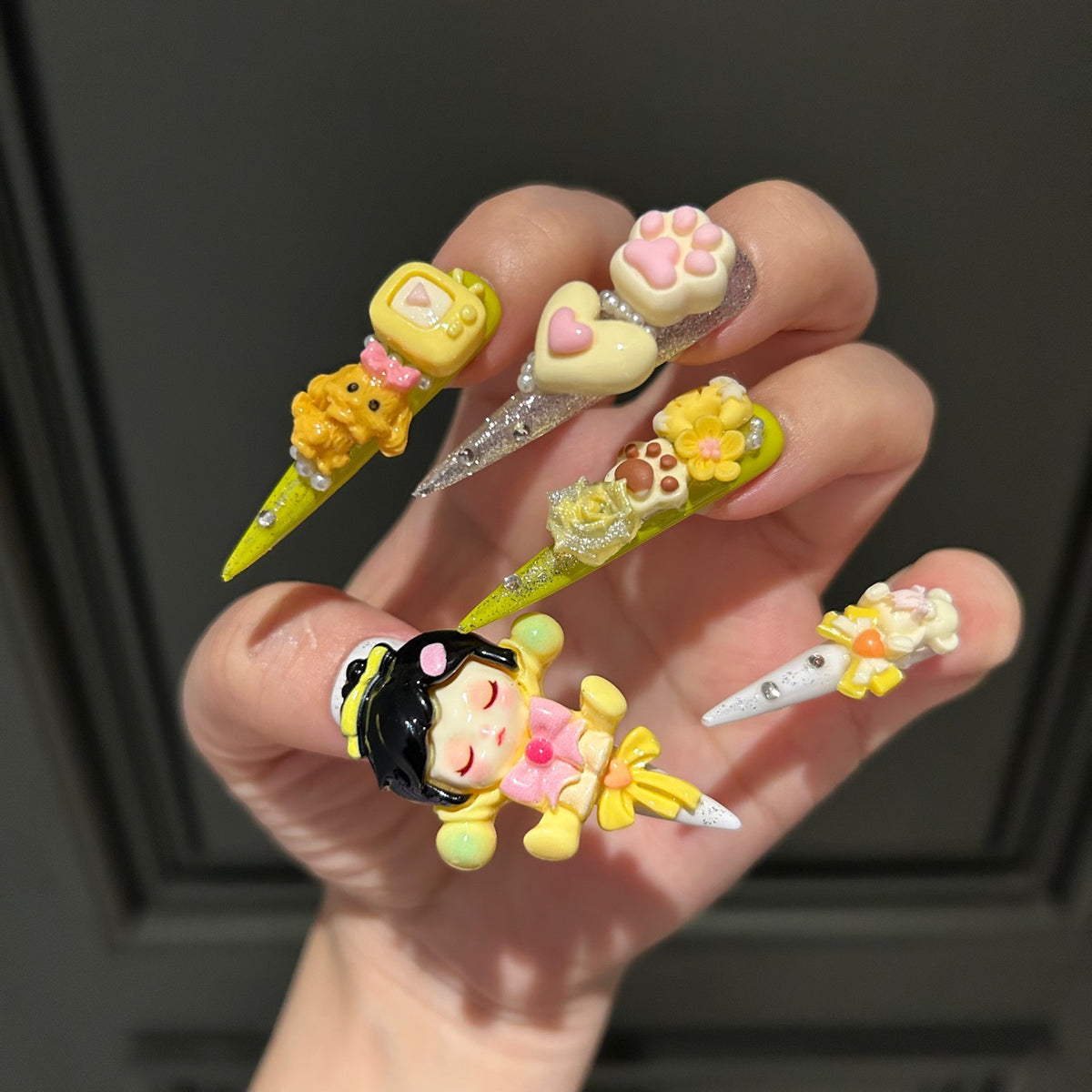 Yellow Kawaii Stiletto Press-on Nails with 3D Anime Doll, Cat Paw, Cute Puppy, and Floral Charms - Playful Art Toy Fake Nail Set