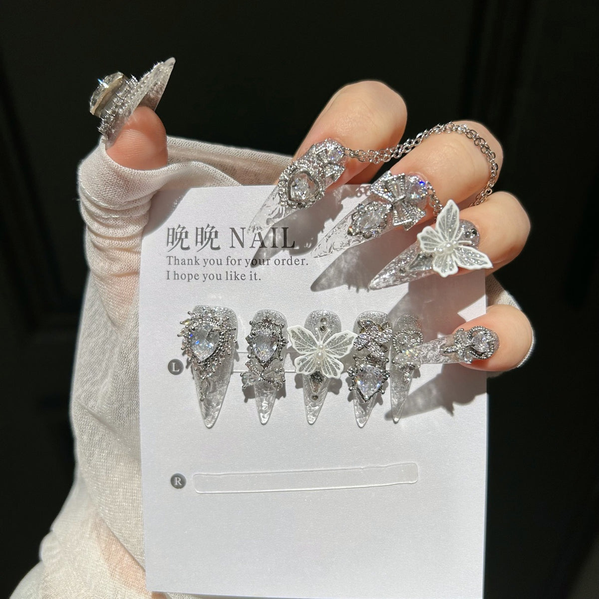 Handmade Silver Glitter Clear Long Stiletto Press On Nails with 3D White Butterfly Charms, Large Heart Crystals, Rhinestone Bows & Dangling Chains