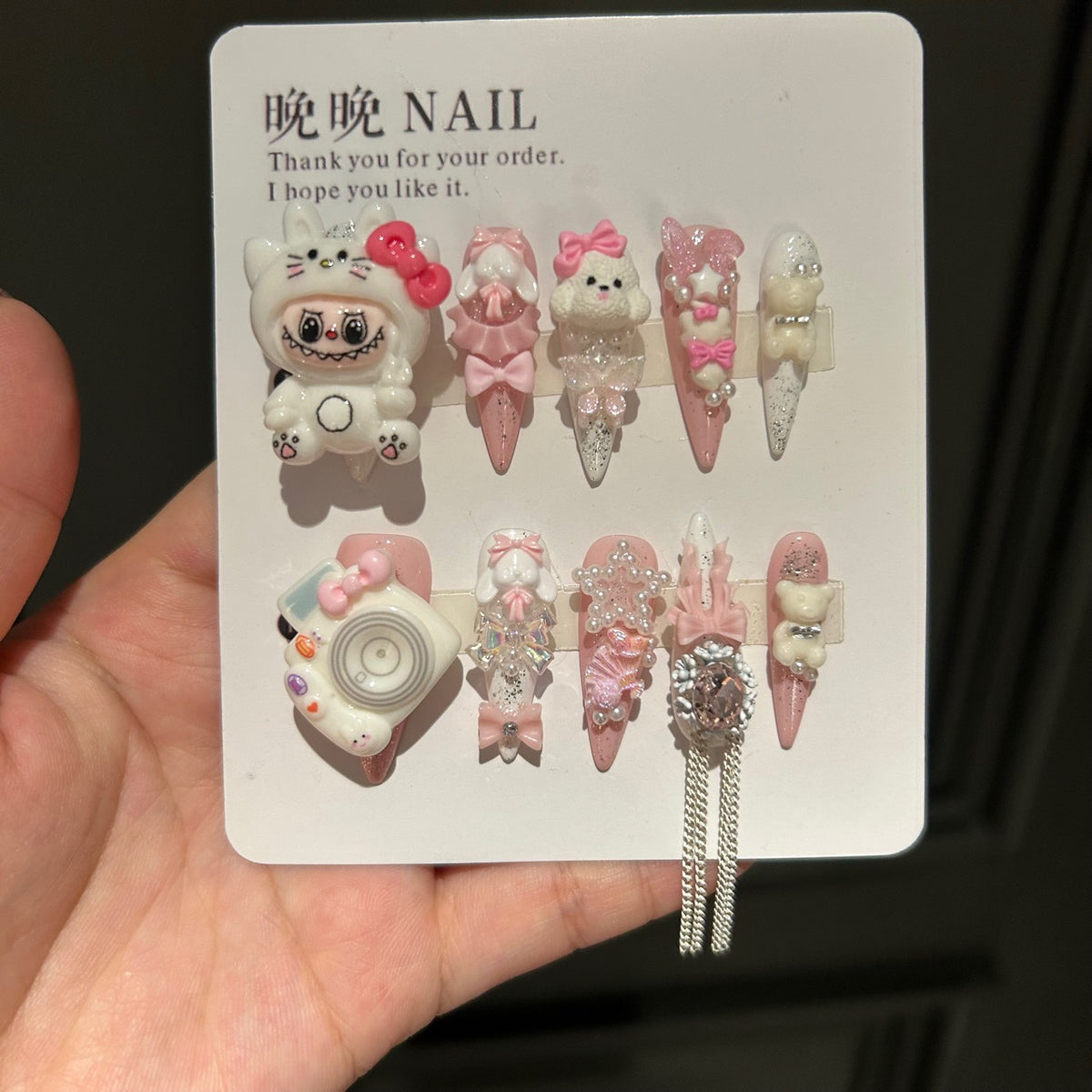Handmade Pink White Press On Nails, Long Stiletto Kawaii False Nails with 3D Labubu Doll, Bunny, Bear & Camera Charms, Bows, Star Rhinestones & Silver Tassel Chains, Reusable Fake Nails for Cosplay & Birthday Party