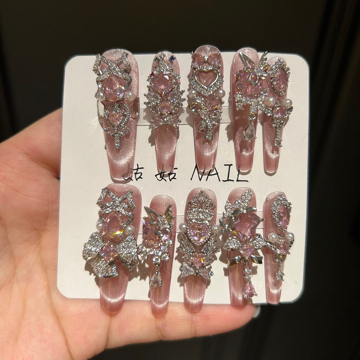 Handmade Pink Cat Eye Long Coffin Press On Nails with Pink Heart Crystals, Crown & Cross Rhinestone Ornaments, Pearl Accents & Dangling Charms