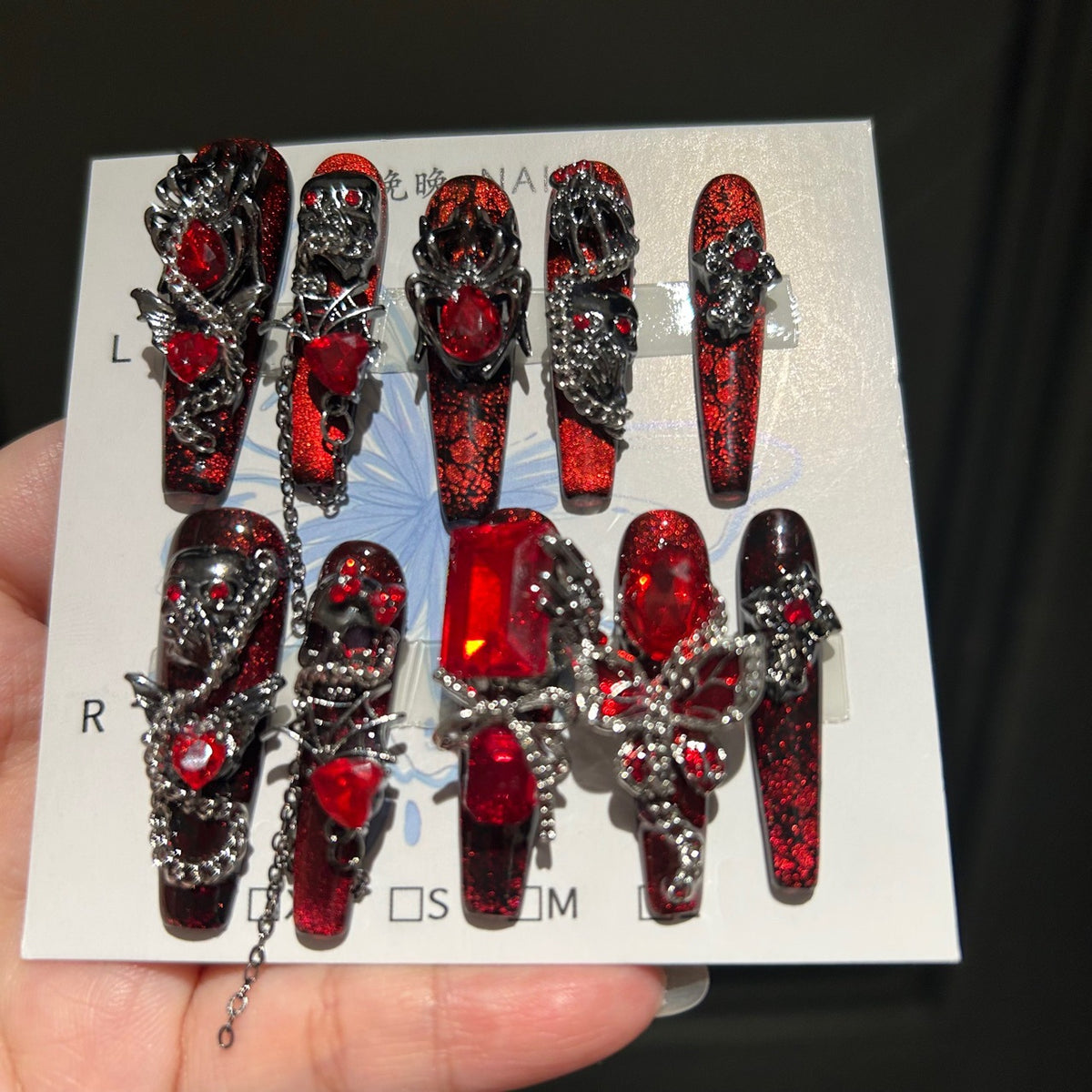 Handcrafted Designer Dark Aesthetic Press-on Nails - Shimmering Red-Black Base with Heavy 3D Gemstones, Skull Art and Chain Drops