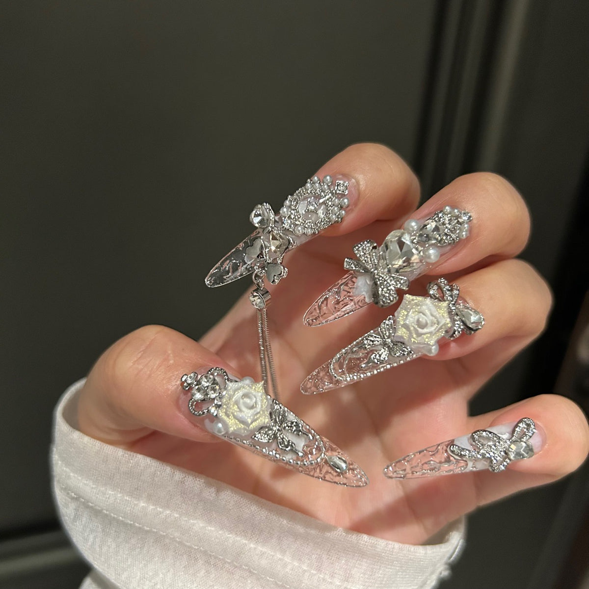 Handmade Clear Transparent Long Stiletto Press On Nails with 3D White Roses, Silver Rhinestone Bows, Crown & Butterfly Charms, Pearls & Dangling Silver Chains