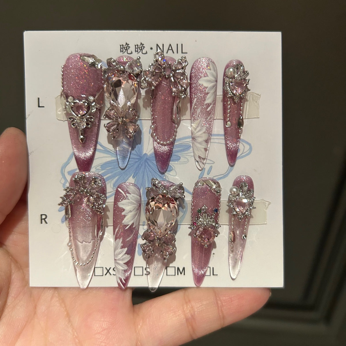 Handcrafted Designer Pink Press-on Nails - Shimmering Cat Eye Base with Intricate 3D Floral, Rhinestones and Chain Drops
