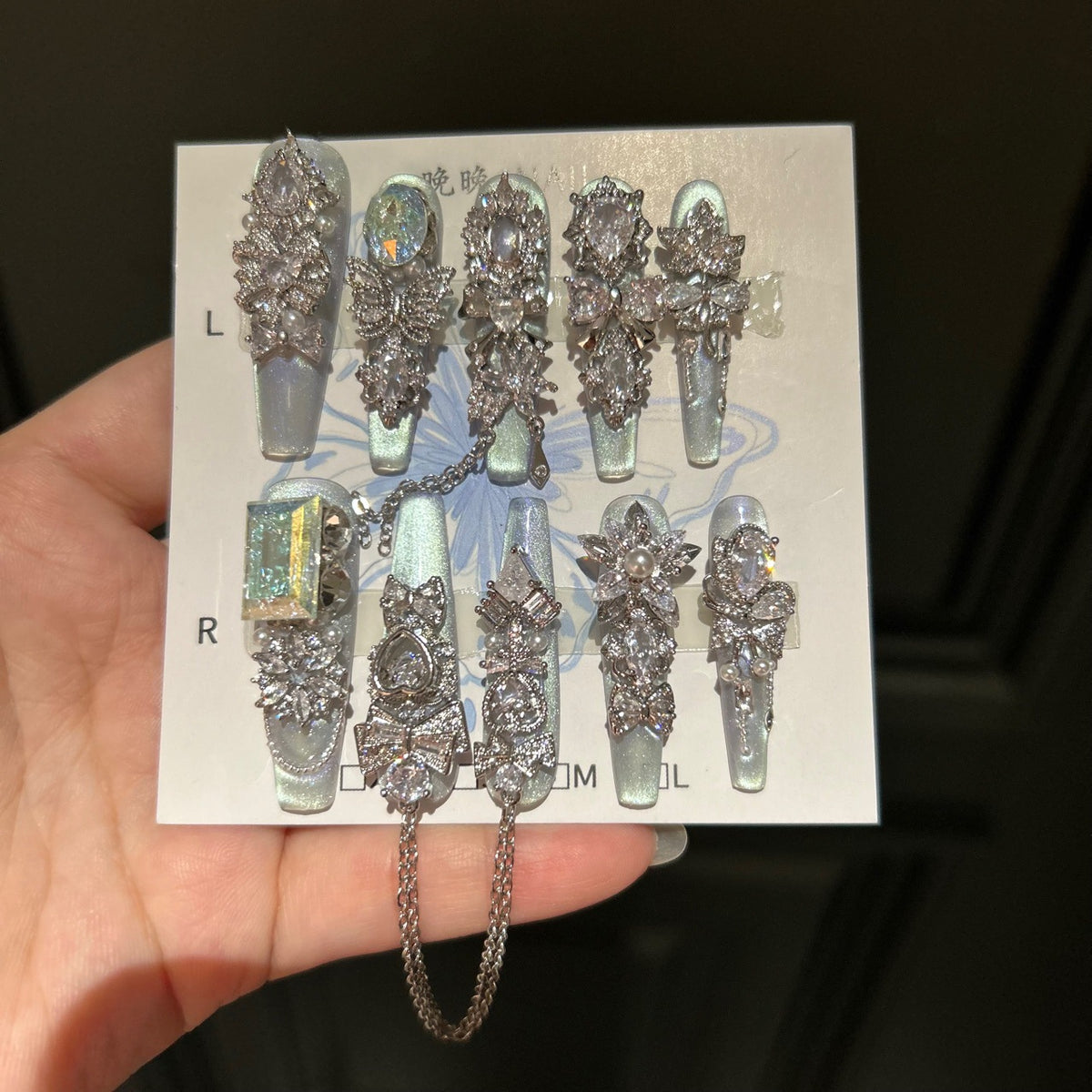 Silver Blue Cat Eye Coffin Press-on Nails with Over-sized Crystal Gems, Bowknot, and Interlinked Hanging Chain - Luxury Glam Fake Nail Set