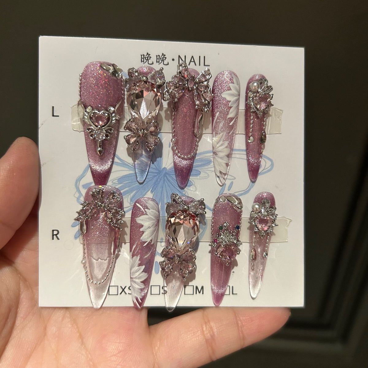 Handcrafted Designer Pink Press-on Nails - Shimmering Cat Eye Base with Intricate 3D Floral, Rhinestones and Chain Drops