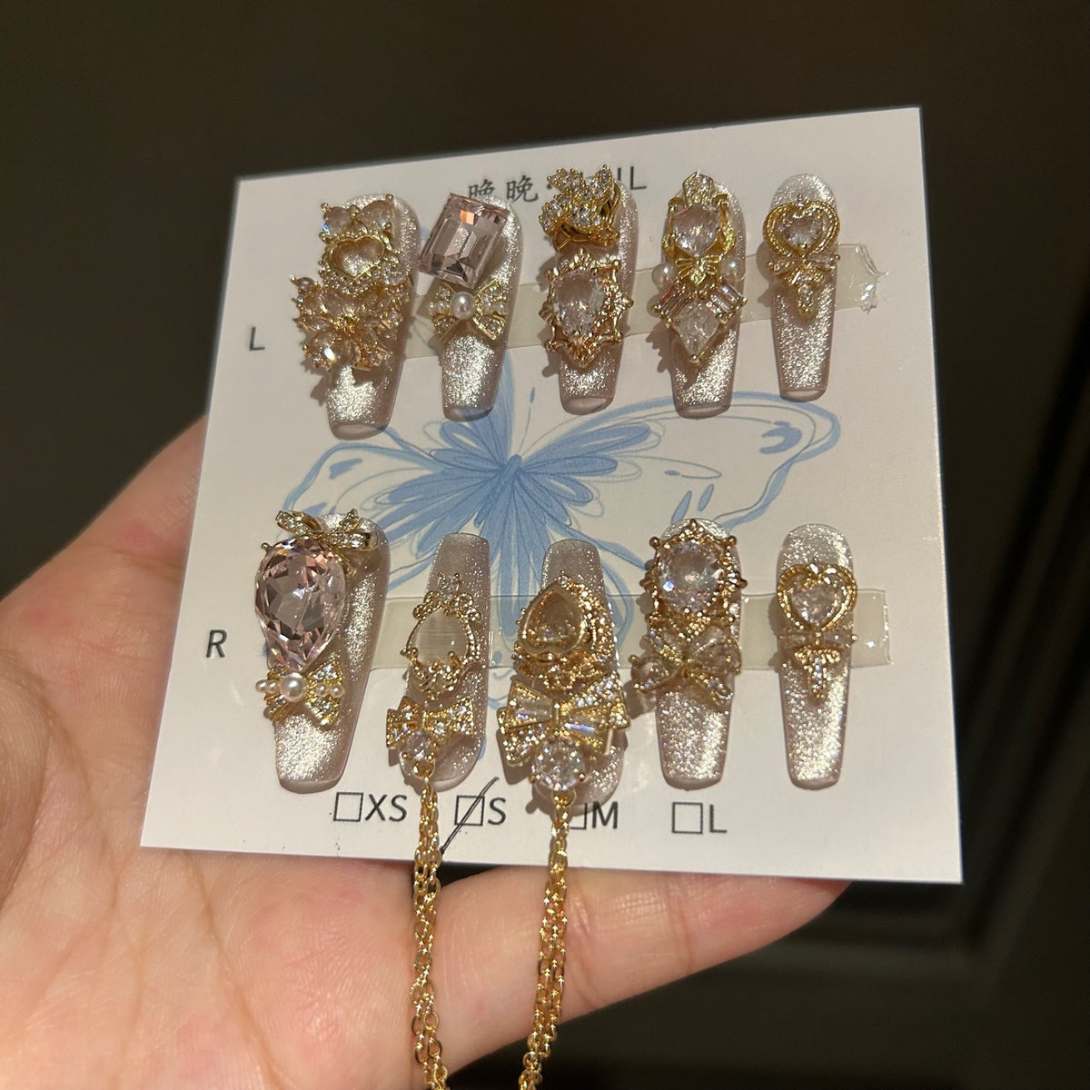 Champagne Silver Cat Eye Coffin Press-on Nails with 3D Bowknot, Crystal Jewels, and Hanging Chain Charms - Luxury Statement Fake Nail Set