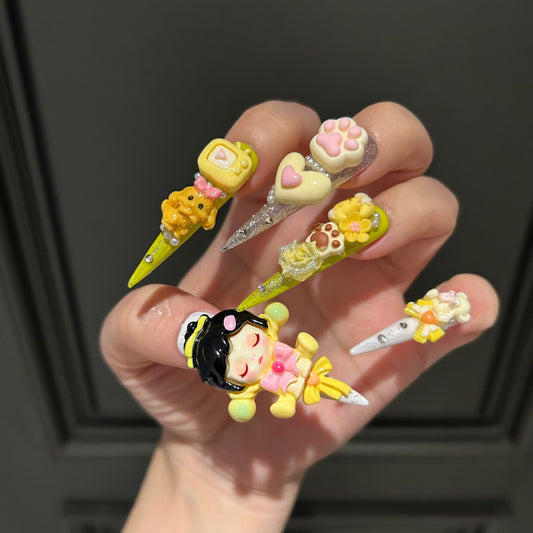 Yellow Kawaii Stiletto Press-on Nails with 3D Anime Doll, Cat Paw, Cute Puppy, and Floral Charms - Playful Art Toy Fake Nail Set