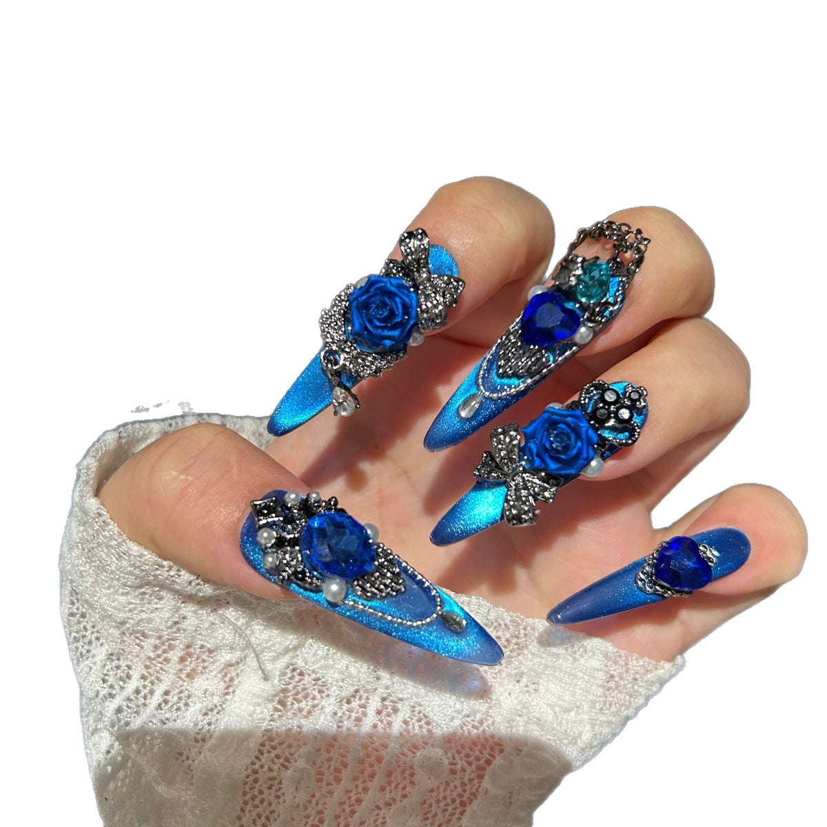 Handmade Electric Blue Cat Eye Long Stiletto Press On Nails with 3D Blue Roses, Giant Blue Heart Crystals, Rhinestone Crowns, Butterfly Charms & Dangling Chains