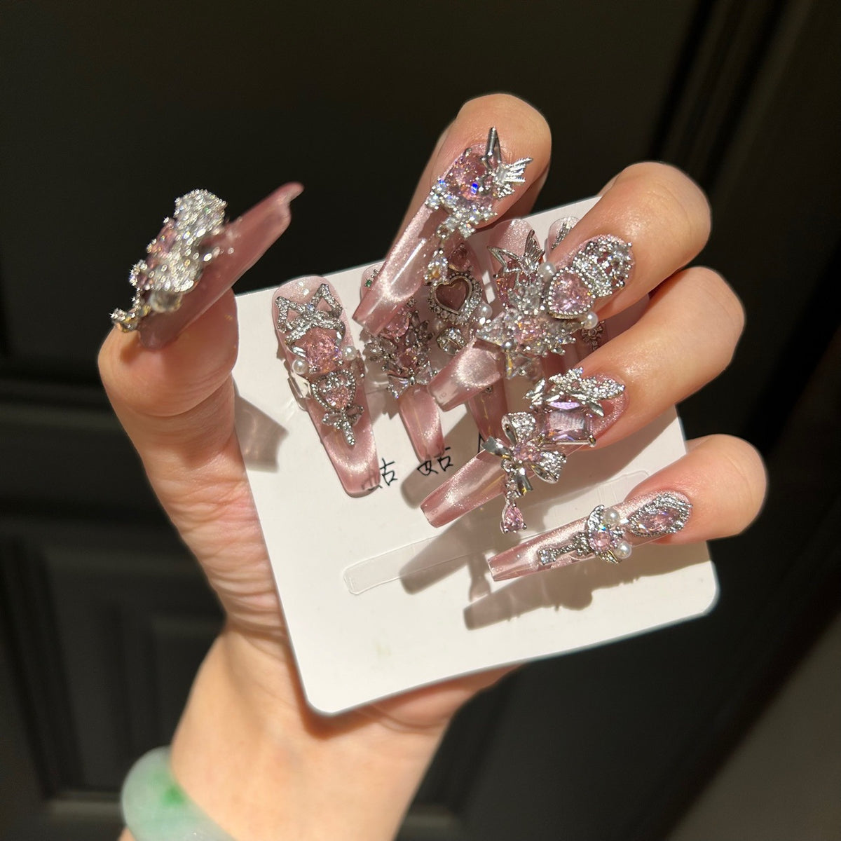 Handmade Pink Cat Eye Long Coffin Press On Nails with Pink Heart Crystals, Crown & Cross Rhinestone Ornaments, Pearl Accents & Dangling Charms