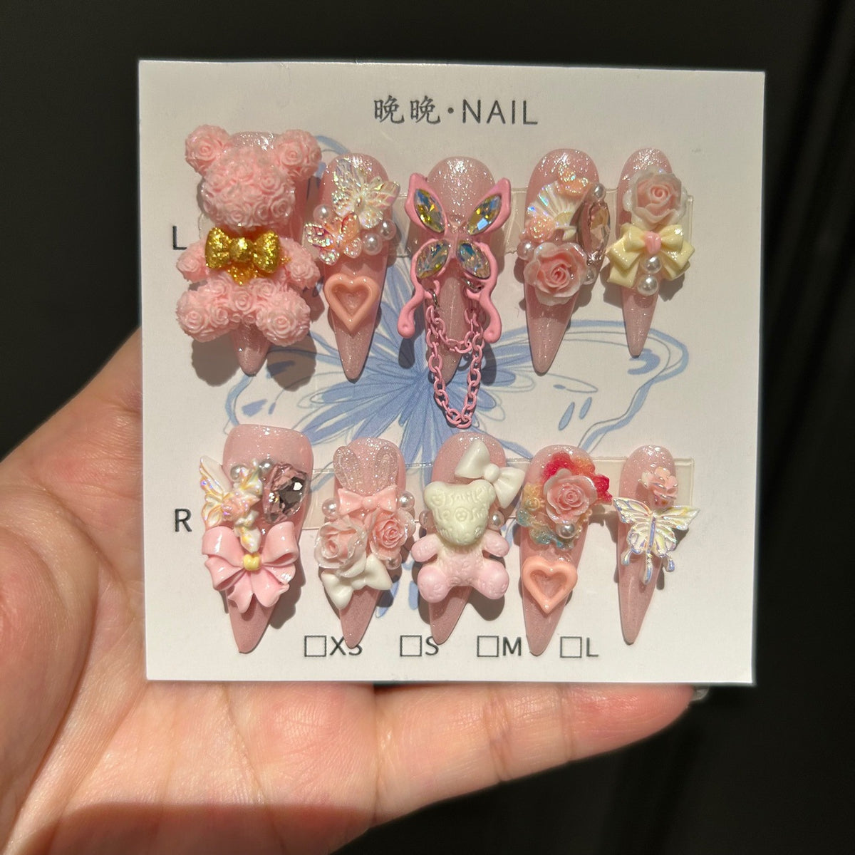 Handmade Pink Glitter Long Stiletto Press On Nails with 3D Rose Bear Charms, Butterfly Ornaments, 3D Roses, Bows, Heart Gems & Pink Chain