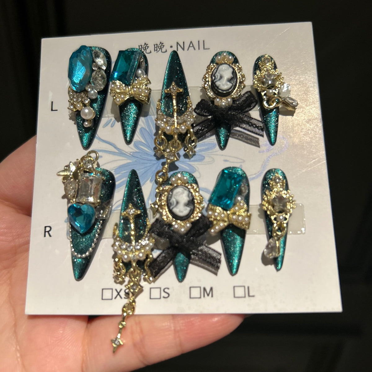 Handmade Teal Cat Eye Long Stiletto Press On Nails with Giant Blue Crystals, Vintage Cameo, Gold Filigree & Black Bows