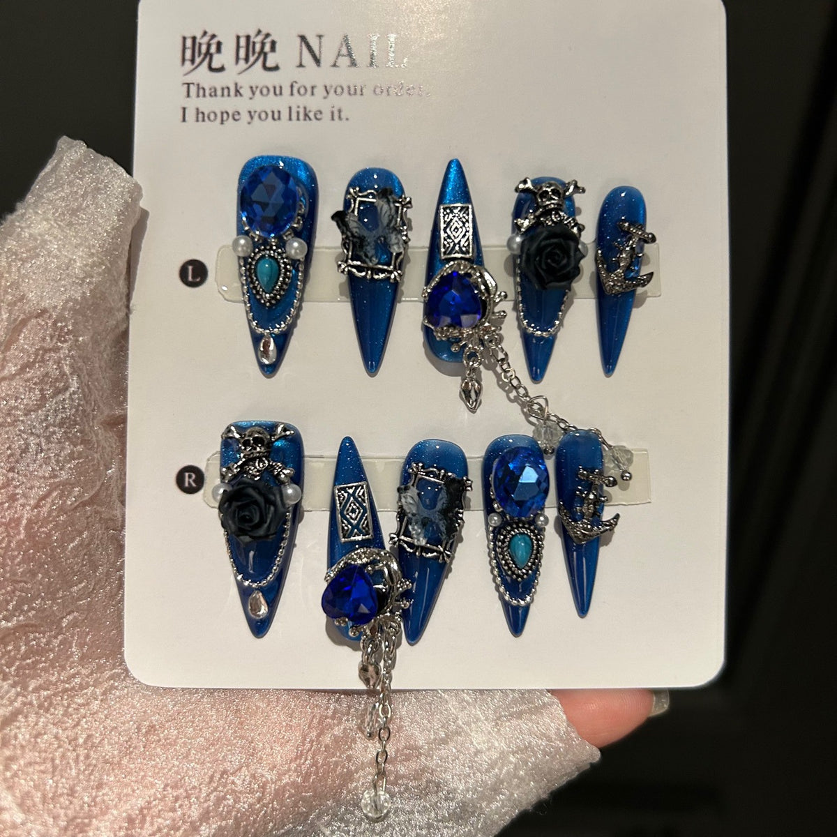 Royal Blue Cat Eye Stiletto Press-on Nails with Oversized Blue Crystals, 3D Black Rose, Skull, Vintage Frame, and Interlinked Chain - Gothic Cyber Fake Nail Set