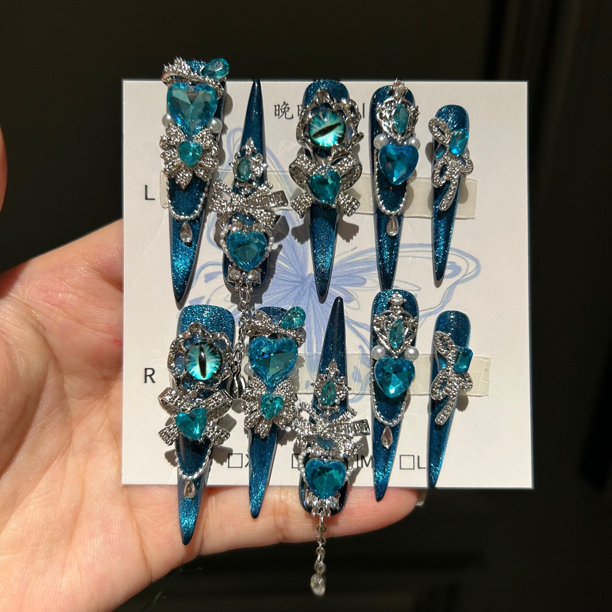 Handmade Teal Blue Cat Eye Long Stiletto Press On Nails with Evil Eye, Blue Heart Crystals & Rhinestone Bow Charms