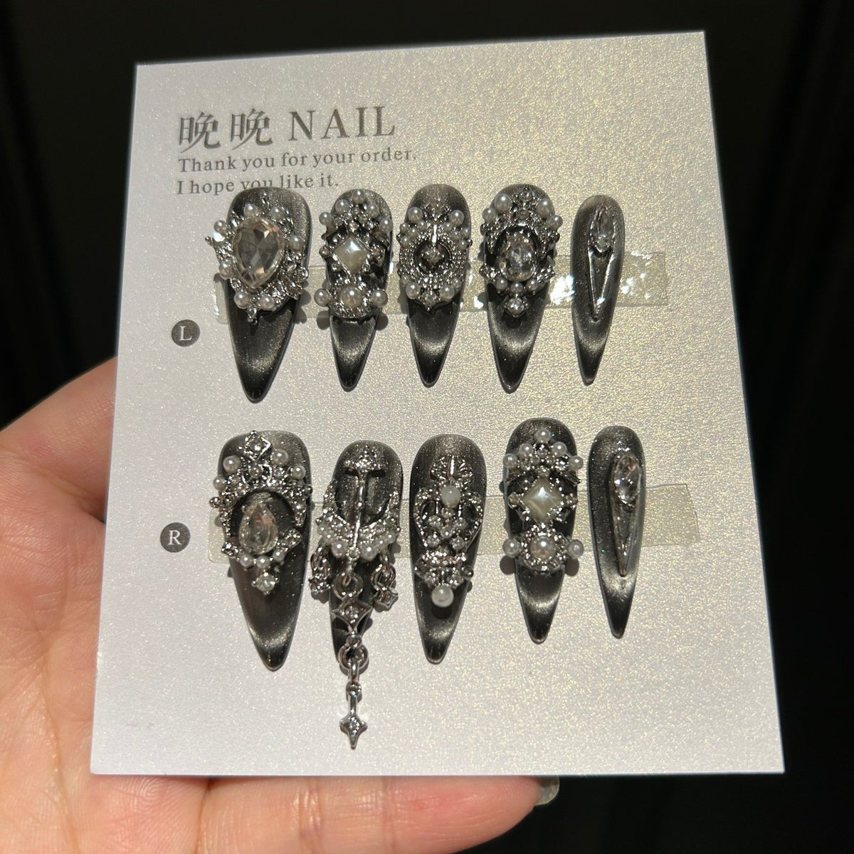 Handmade Black Silver Cat Eye Press On Nails, Long Stiletto Gothic False Nails with Cross Charms, Pearls, Large Rhinestones & Dangling Chain, Reusable Fake Nails for Party & Cosplay