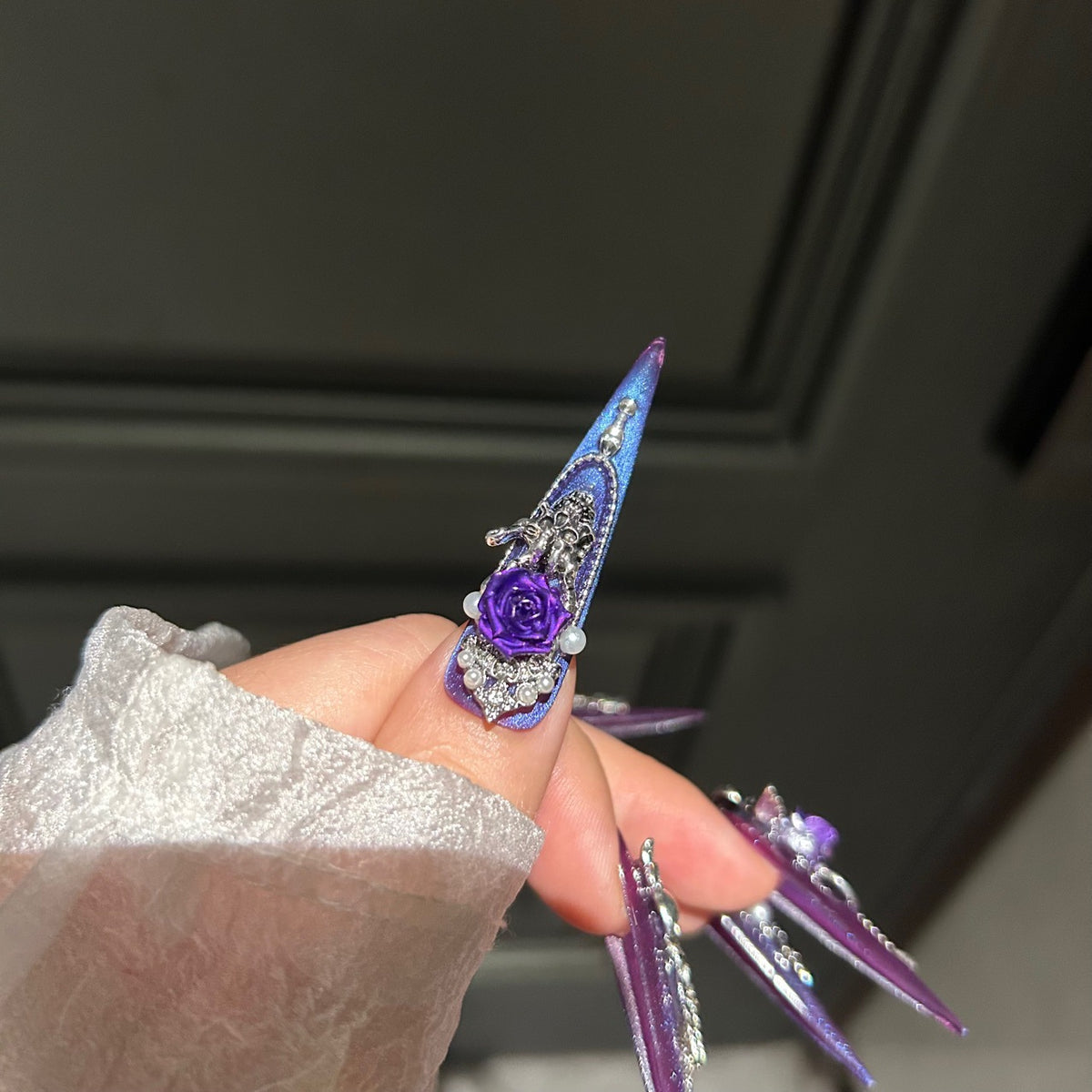 Handmade Purple Blue Cat Eye Long Stiletto Press On Nails with 3D Purple Roses, Silver Skull Charms, Black Crystals, Pearls & Dangling Chains