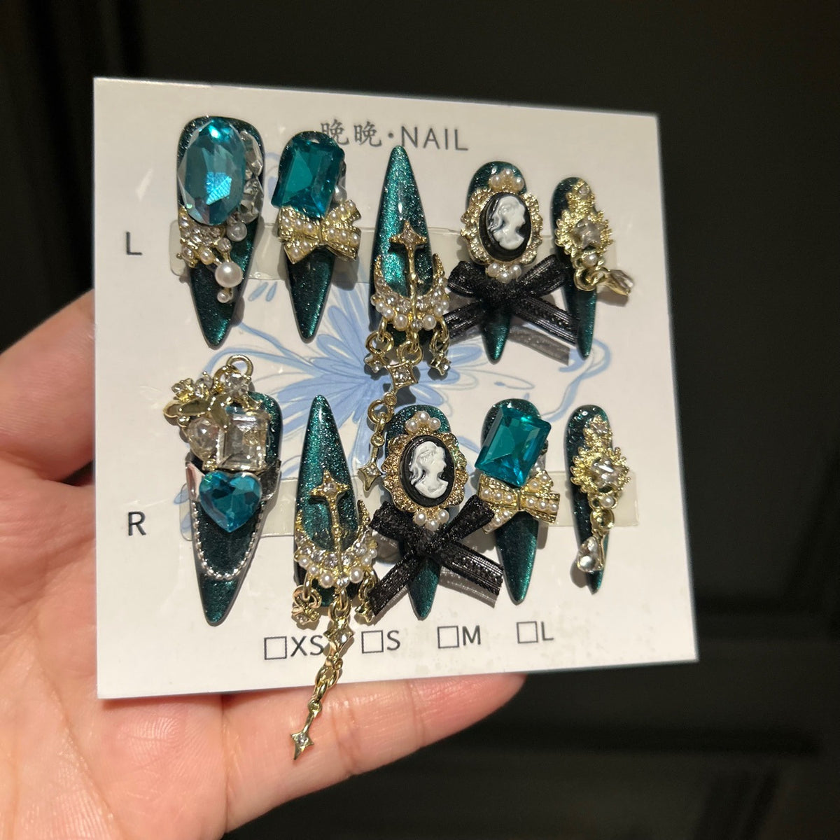 Handmade Teal Cat Eye Long Stiletto Press On Nails with Giant Blue Crystals, Vintage Cameo, Gold Filigree & Black Bows