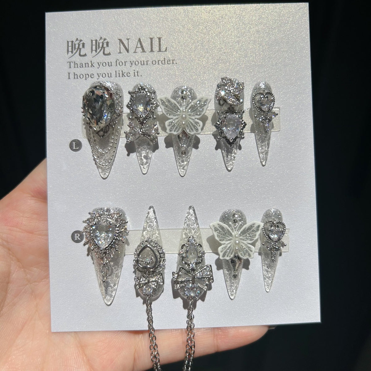 Handmade Silver Glitter Clear Long Stiletto Press On Nails with 3D White Butterfly Charms, Large Heart Crystals, Rhinestone Bows & Dangling Chains