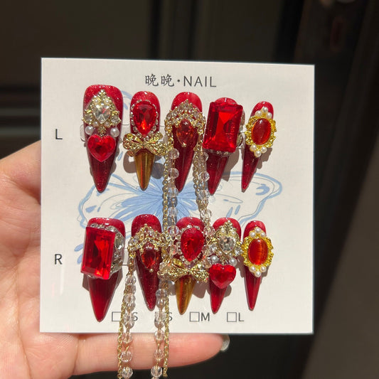 Handmade Red Glitter Press On Nails, Long Stiletto Luxury Royal False Nails with Large Ruby Rhinestones, Gold Charms, Pearls & Long Dangling Crystal Chains, Reusable Fake Nails for Party, Cosplay & Holiday