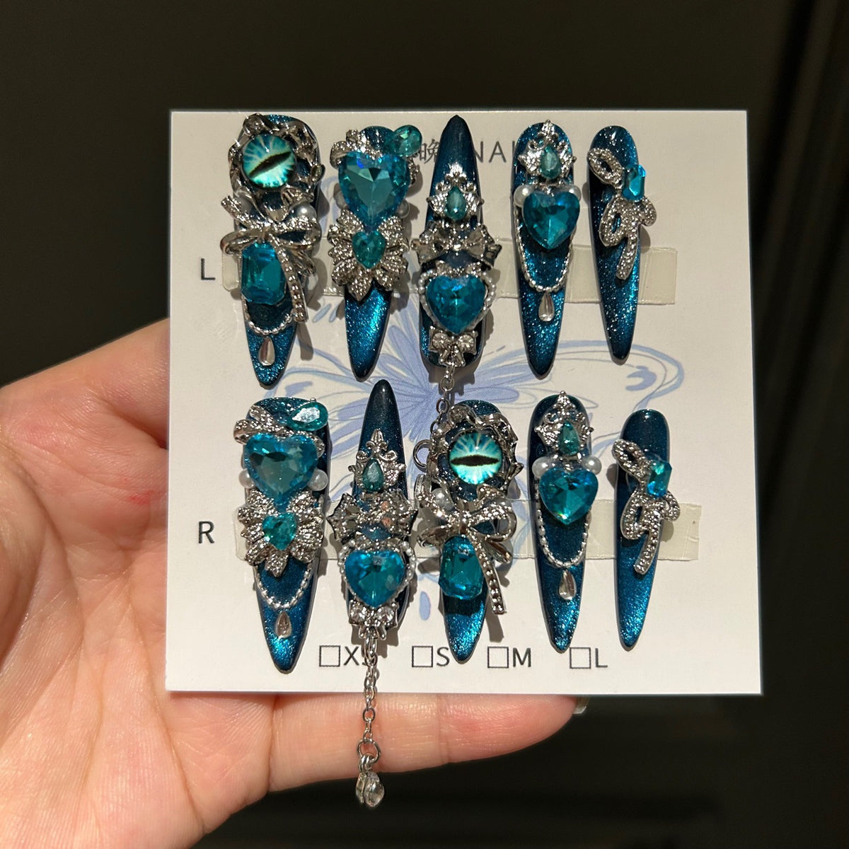Handmade Teal Blue Cat Eye Long Stiletto Press On Nails with Evil Eye, Blue Heart Crystals & Rhinestone Bow Charms