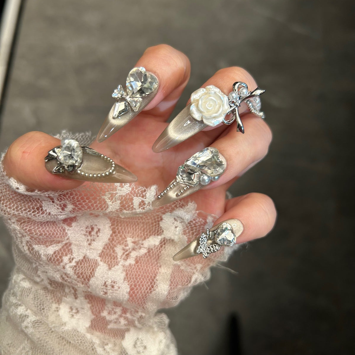 Champagne Cat Eye Stiletto Press-on Nails with Oversized Crystal Diamonds, 3D White Rose, Bow, and Pearl Rhinestone Chain - Luxury Glam Fake Nail Set