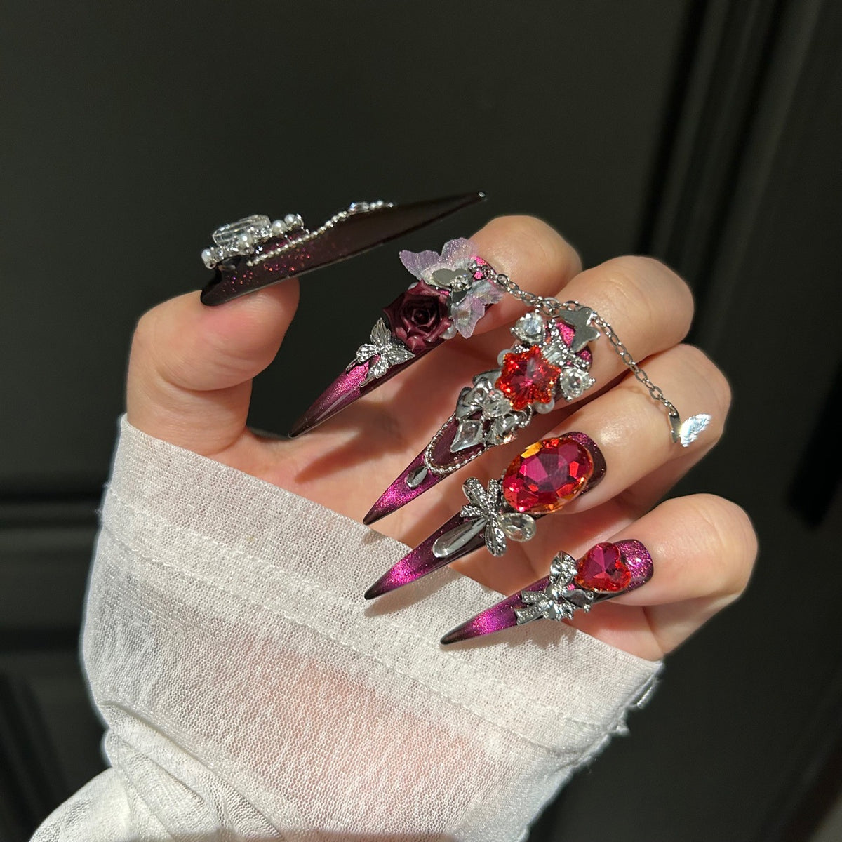 Burgundy Cat Eye Stiletto Press-on Nails with Oversized Ruby Crystals, 3D Dark Red Rose, Bow, and Interlinked Chain - Gothic Glam Fake Nail Set