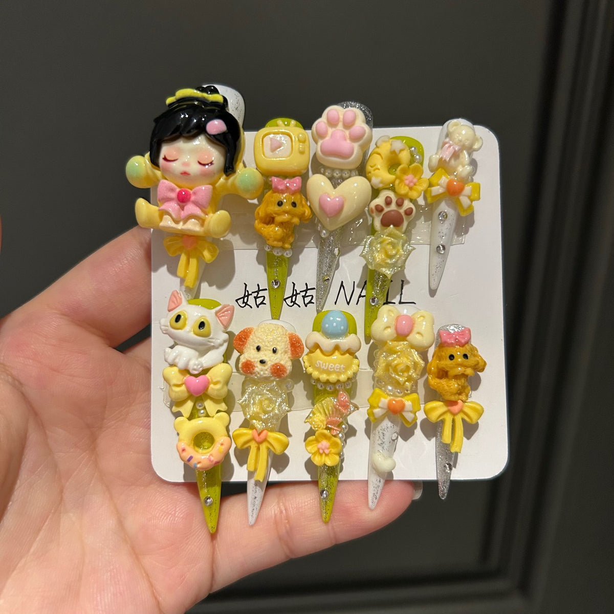 Yellow Kawaii Stiletto Press-on Nails with 3D Anime Doll, Cat Paw, Cute Puppy, and Floral Charms - Playful Art Toy Fake Nail Set