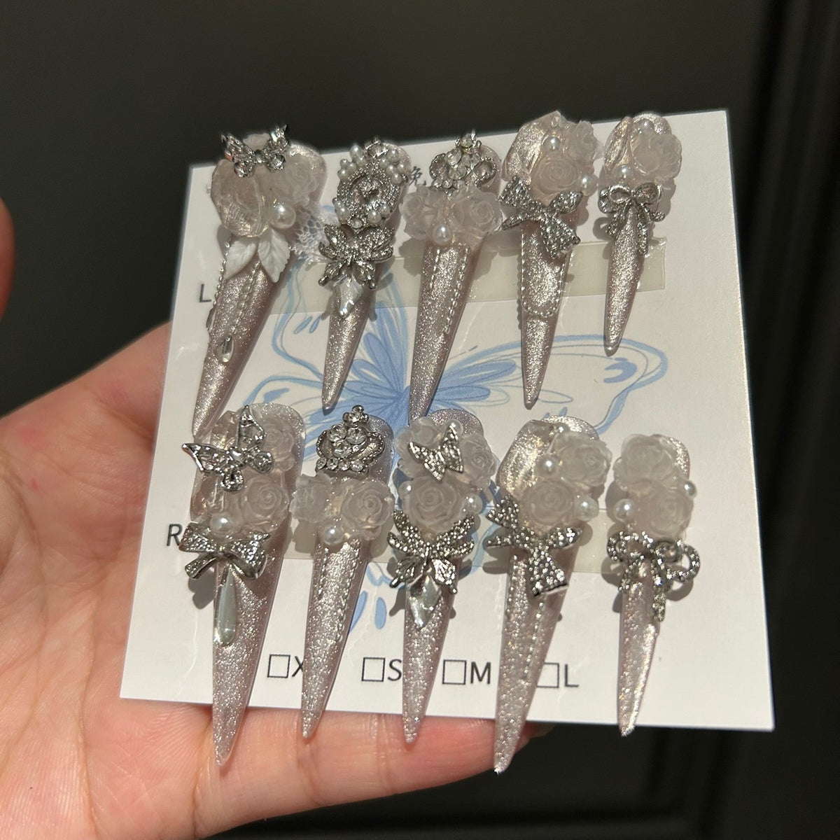 Handmade Silver Glitter Long Stiletto Press On Nails with Frosted White Roses, Rhinestone Bows & Butterfly Charms