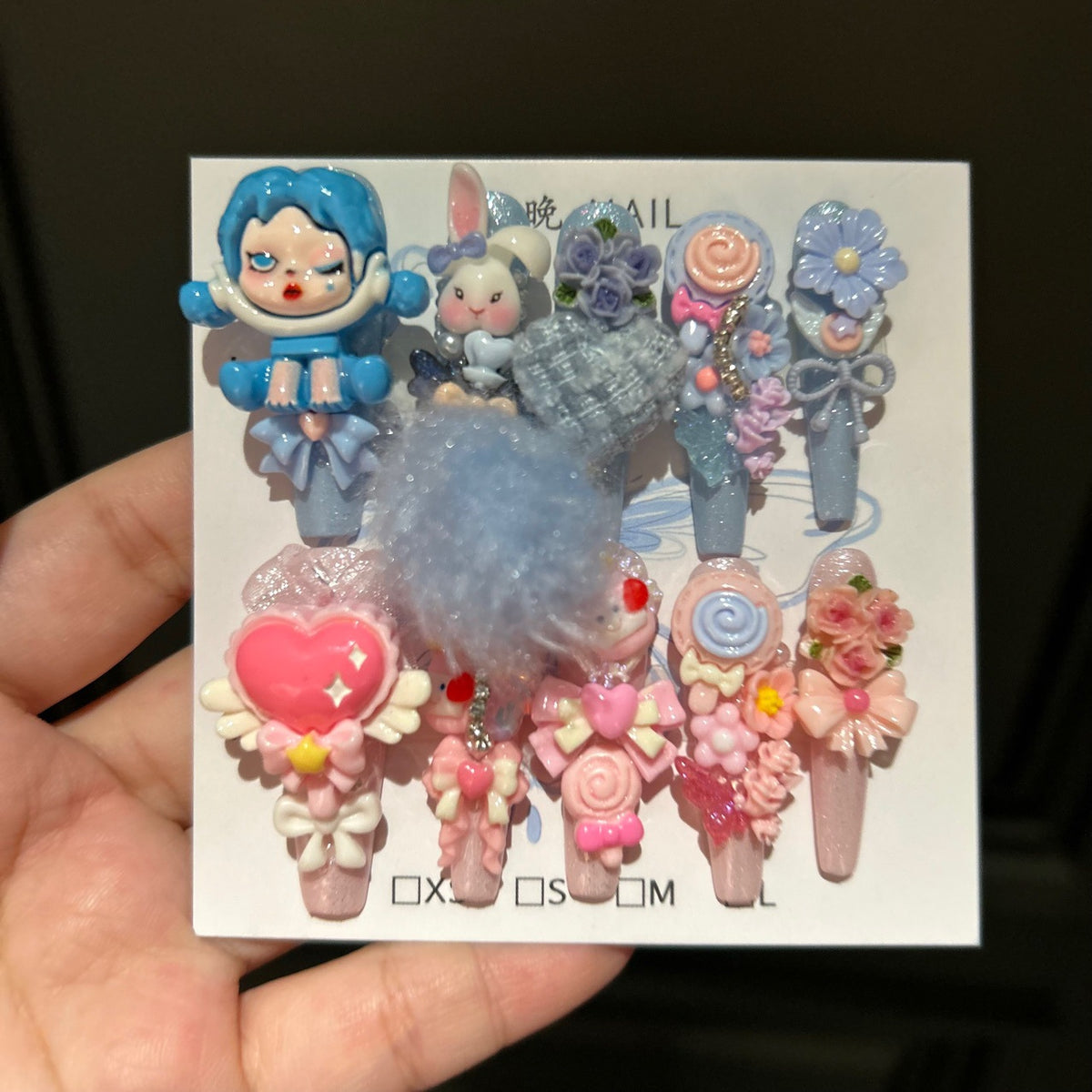 Y2K Blue and Pink Coffin Press-on Nails with 3D Anime Doll, Fluffy Pom-Pom, Lollipop, and Cute Cartoon Charms - Sweet & Cool Fake Nail Set