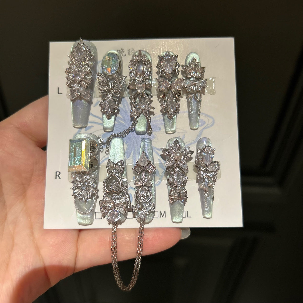 Silver Blue Cat Eye Coffin Press-on Nails with Over-sized Crystal Gems, Bowknot, and Interlinked Hanging Chain - Luxury Glam Fake Nail Set