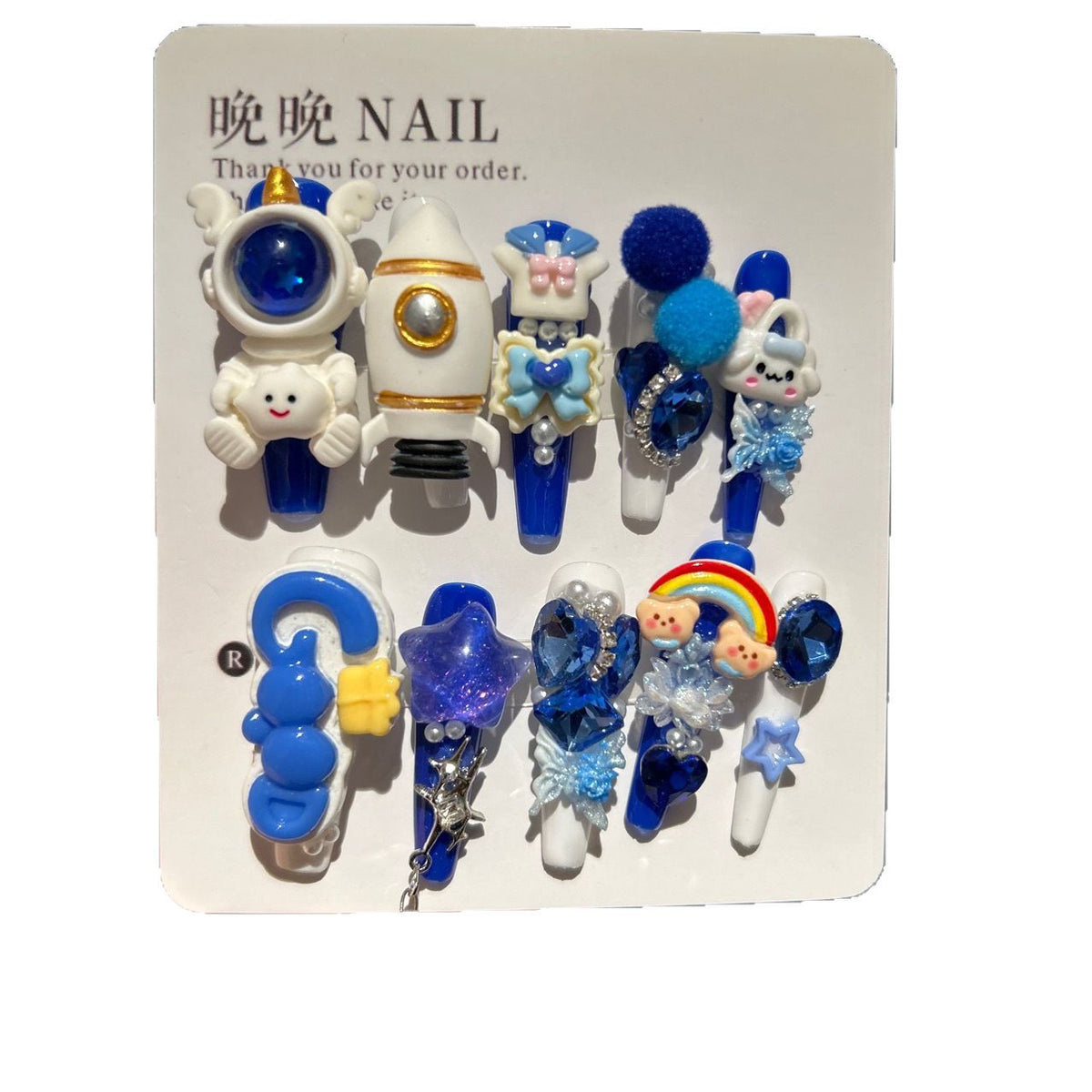 Klein Blue & White Stiletto Press-on Nails with 3D Astronaut, Rocket, Rainbow Bear, Fluffy Ball, and Interlinked Chain - Space Kawaii Fake Nail Set