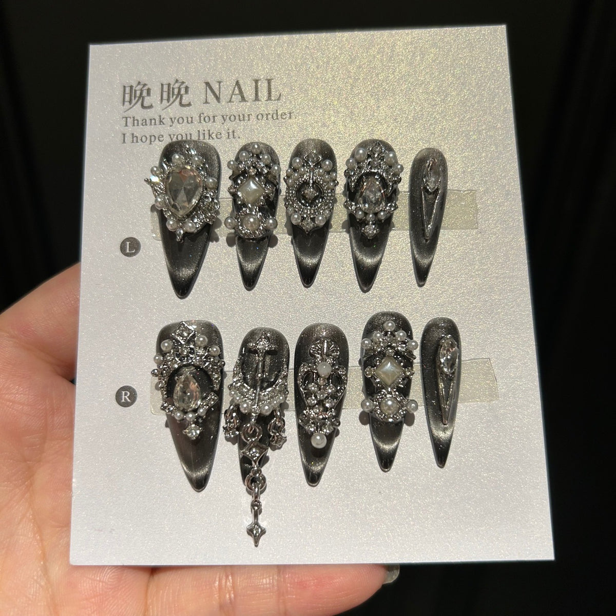 Handmade Black Silver Cat Eye Press On Nails, Long Stiletto Gothic False Nails with Cross Charms, Pearls, Large Rhinestones & Dangling Chain, Reusable Fake Nails for Party & Cosplay