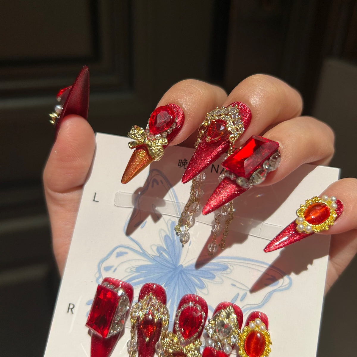 Handmade Red Glitter Press On Nails, Long Stiletto Luxury Royal False Nails with Large Ruby Rhinestones, Gold Charms, Pearls & Long Dangling Crystal Chains, Reusable Fake Nails for Party, Cosplay & Holiday