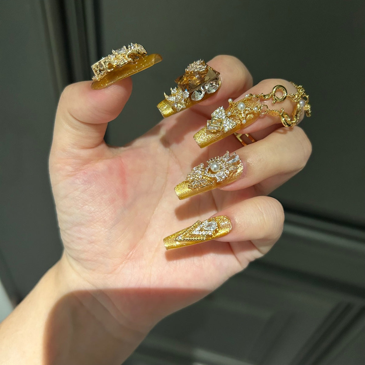 Gold Cat Eye Coffin Press-on Nails with 3D Bowknot, Crystal Rhinestones, and Connected Finger Ring Chain - Luxury Statement Fake Nail Set