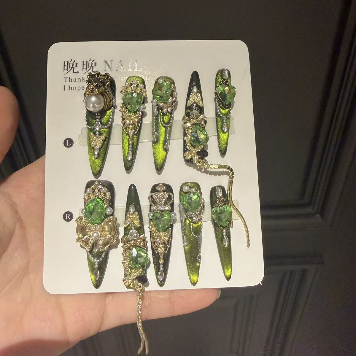 Green Cat Eye Stiletto Press-on Nails with 3D Crown, Crystal Rhinestone, and Chain Charms - Luxury Goth Fake Nail Set