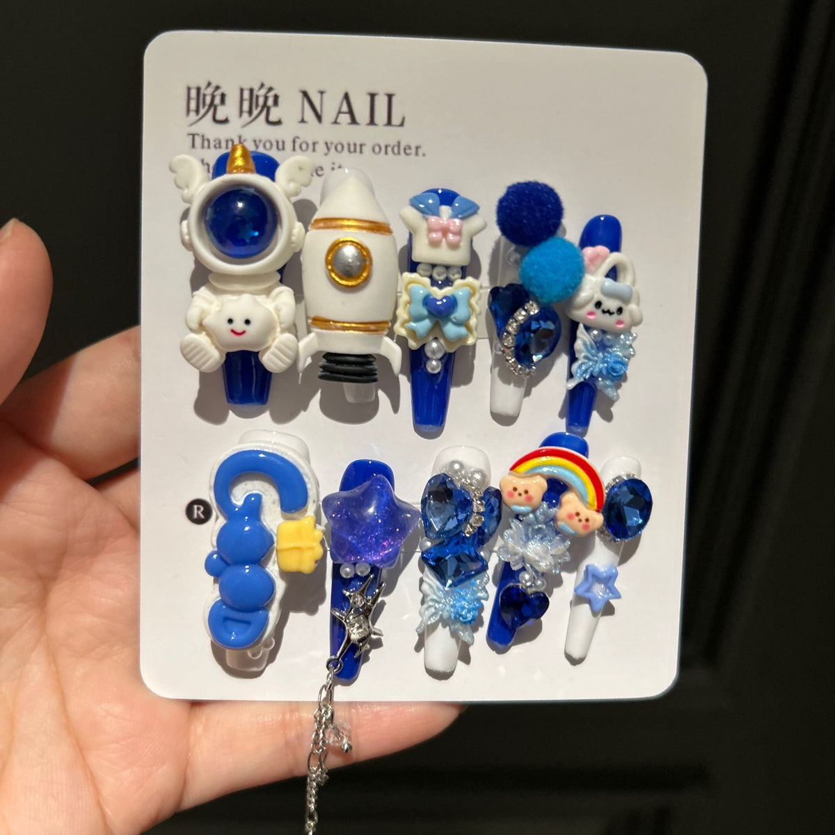 Klein Blue & White Stiletto Press-on Nails with 3D Astronaut, Rocket, Rainbow Bear, Fluffy Ball, and Interlinked Chain - Space Kawaii Fake Nail Set