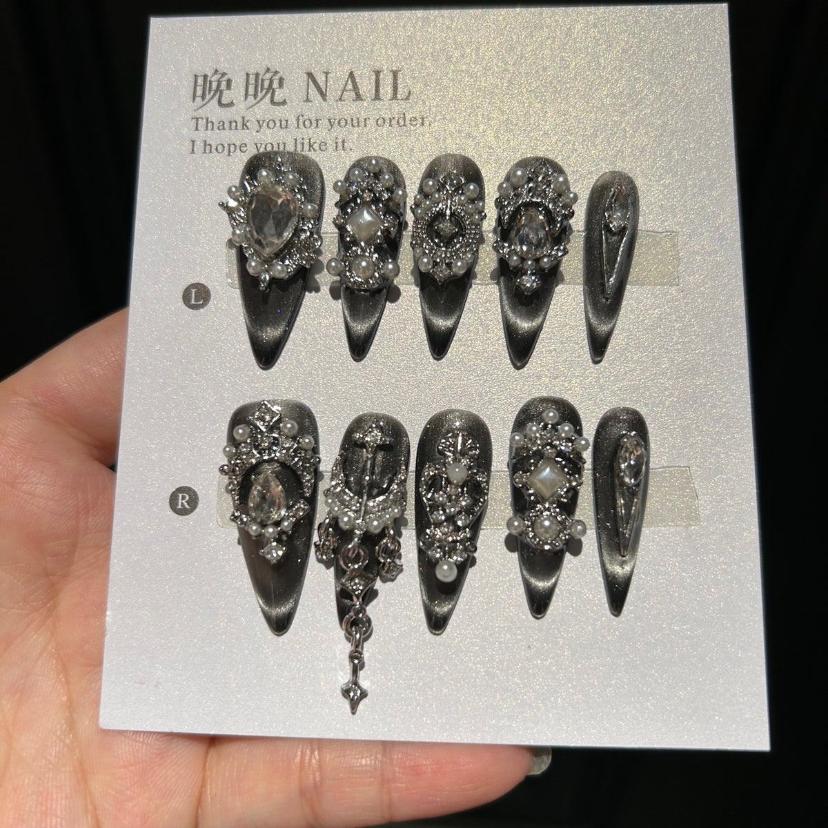 Handmade Black Silver Cat Eye Press On Nails, Long Stiletto Gothic False Nails with Cross Charms, Pearls, Large Rhinestones & Dangling Chain, Reusable Fake Nails for Party & Cosplay